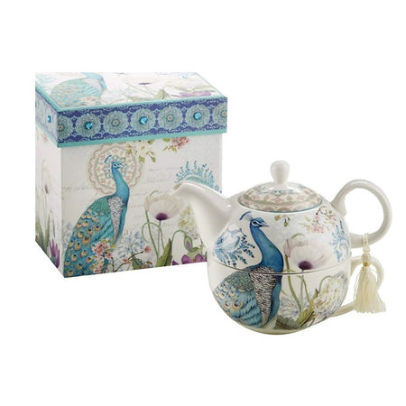 White teapot that features a peacock and flowers. 