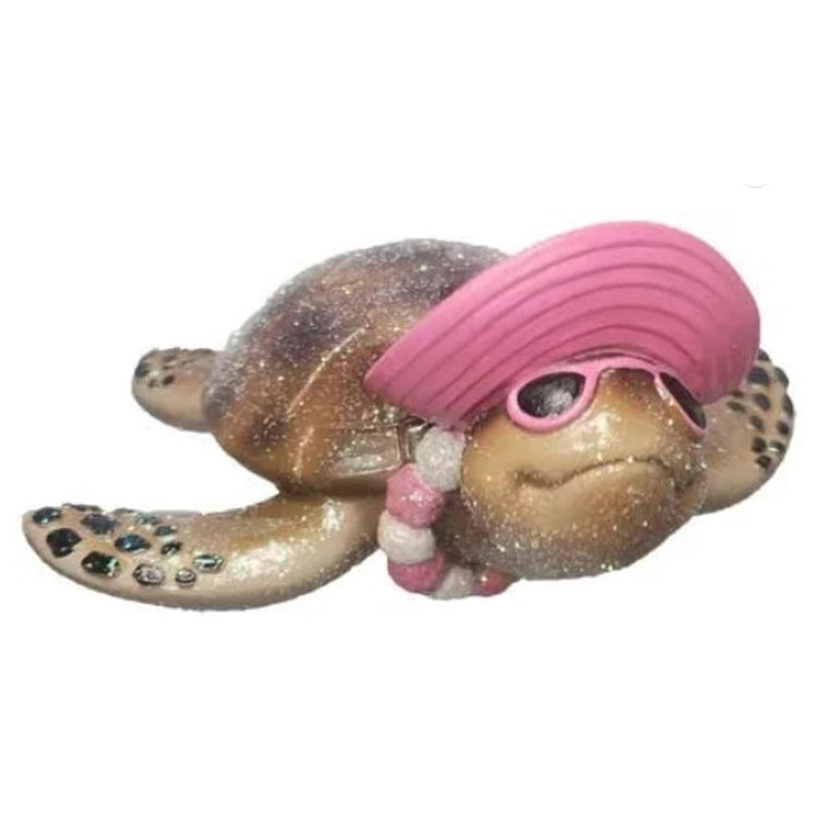 Brown sea turtle with a pink hat & lei on. 