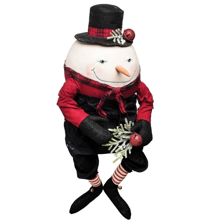 Abercrombie the snowman figurine, he's wearing a red long sleeve shirt, black dress pants, a red plaid scarf and matching top hat.