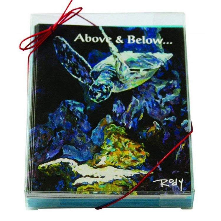 Boxed Christmas cards with a swimming sea turtle.  Dark shades of blue and green with text "Above and below...".
