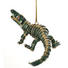 Alligator shaped Christmas ornament.  Green with gold cord and metal accents.