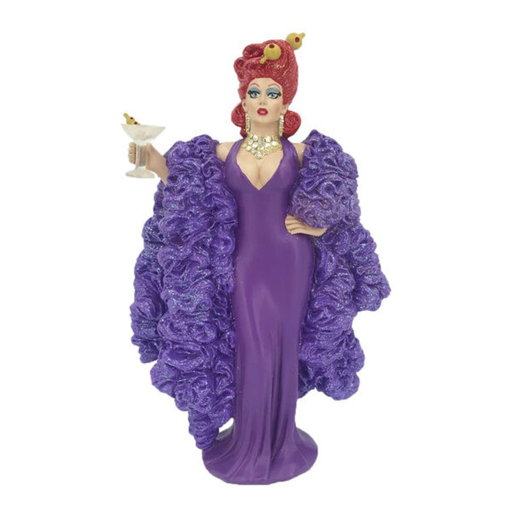 Drag queen figurine. Has red hair with olives stuck in hair. holding a martini out for a toast. Wearing long purple dress with purple boa to the floor.