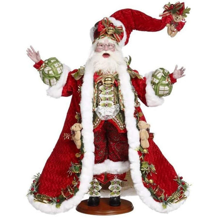 Santa in red hat with teddy bear on the end, red suit, long red coat with teddy bear and toy drum accents.
