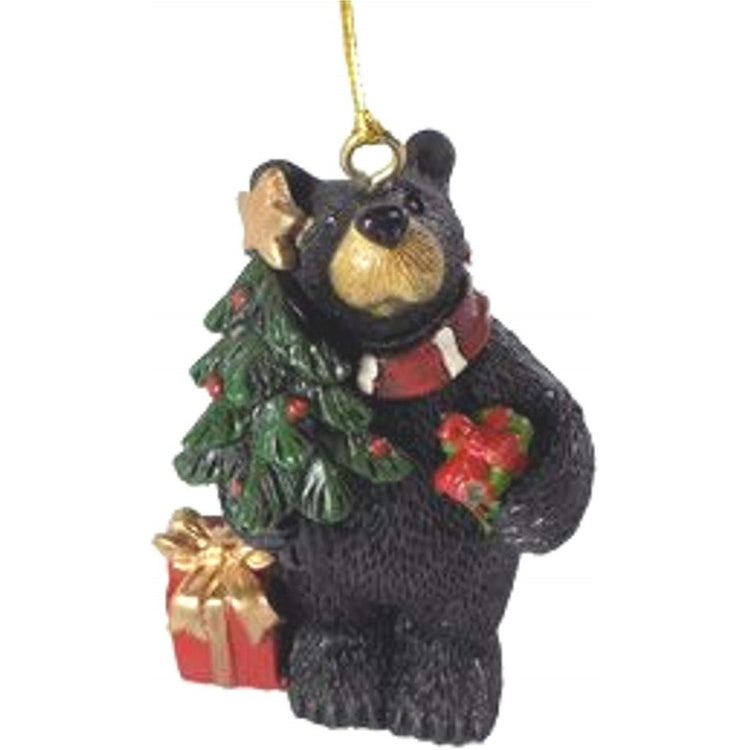 Standing bear shaped Christmas ornament with gold cord.  Bear is carrying 2 red wrapped gifts and Christmas tree.