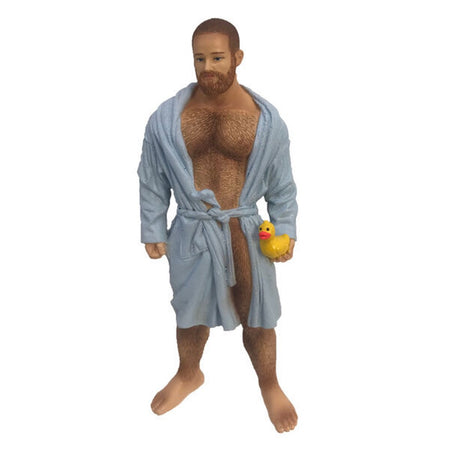 Resin poke the bear ornament, wearing a light blue, slightly open bathrobe and holding a yellow rubber duckie.