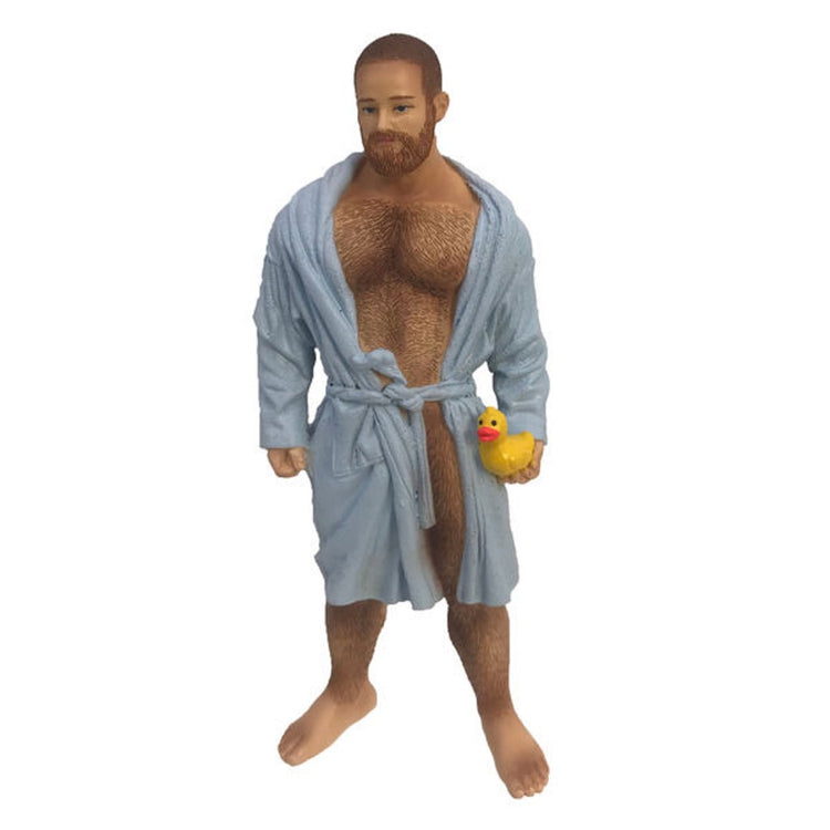 Resin poke the bear ornament, wearing a light blue, slightly open bathrobe and holding a yellow rubber duckie.