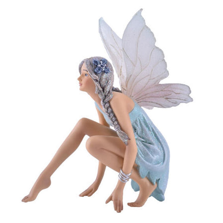 Resin fairy ornament. She's crouching down, wearing a light blue dress, her silvery hair is braided with a blue flower in it.