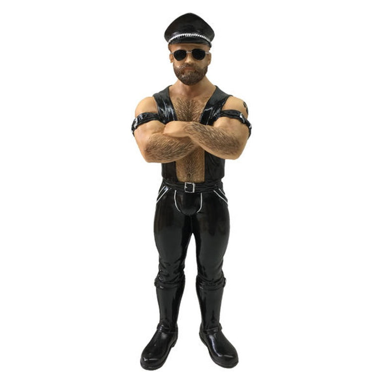 Man dressed in typical biker gear like black leather and hat.  Figurine hanging ornament.