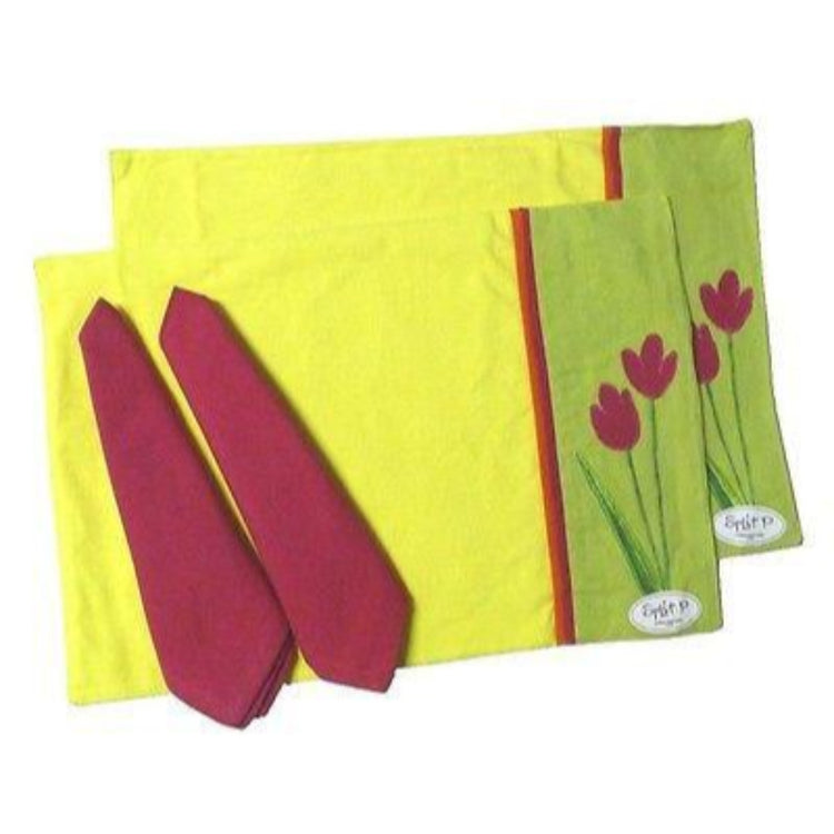2 fabric placemats & 2 fabric napkins. The placemats are yellow, pink & green with a pink tulip design. The napkins are pink.