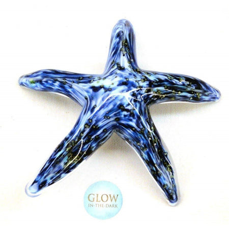 Blue, black & white swirled glass starfish, laying flat.