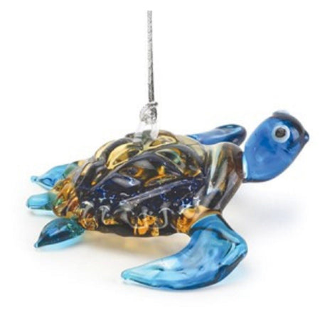 Swimming blue glass sea turtle with black & gold shell. Ornament hanger is on top of shell.