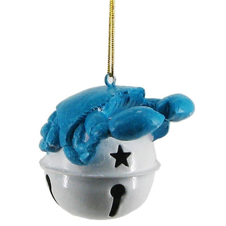 Blue crab sitting on top of a grey jingle bell ornament.
