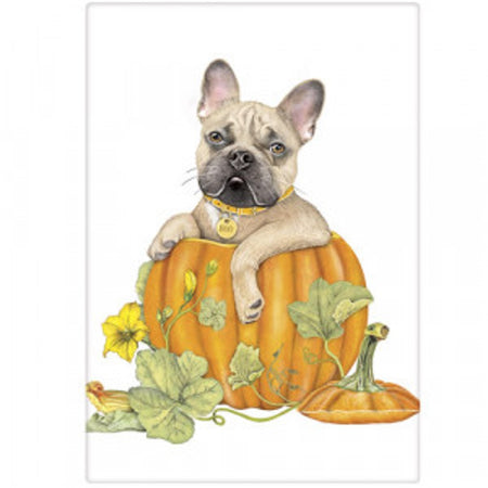 Tan Frenchie dog sitting in a pumpkin with ivy leaves. 