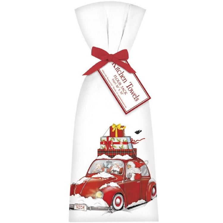 White flour sack kitchen towels tied with red bow imprinted with red bug car stacked with gifts.