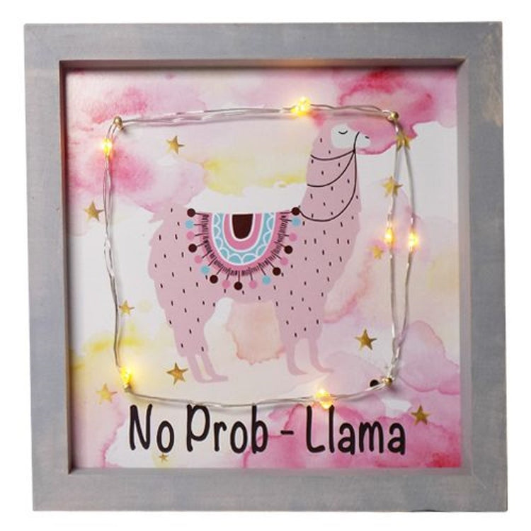 Grey frame with pink llama with a blue & pink saddle. Lights surrounding the llama. Saying "No Prob-Llama'.