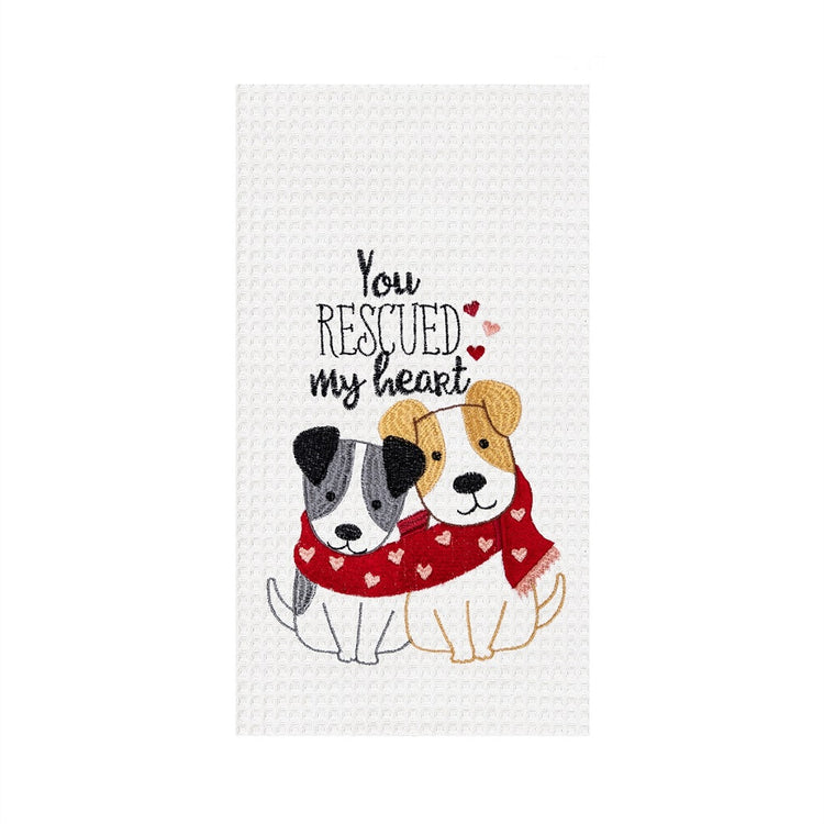 White waffle weave towel with two puppies sharing a red heart patterned scarf, with the embroidered phrase "You rescued my heart."