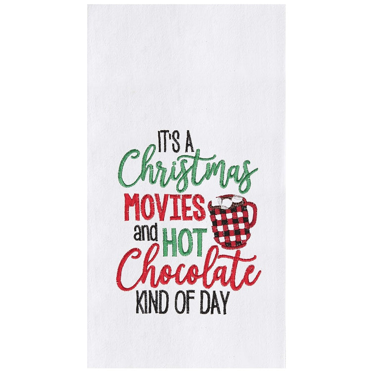 white towel with red and green embroidery that says "it's a christmas movies and hot chocolate kind of day"