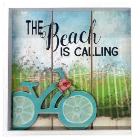 3 wood plank in a white frame. Teal bike with a hibiscus and a picket fence and grass in the background.