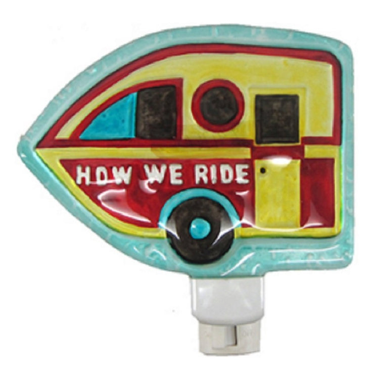 Yellow & red camper night light that says 'HOW WE RIDE' on the side. 
