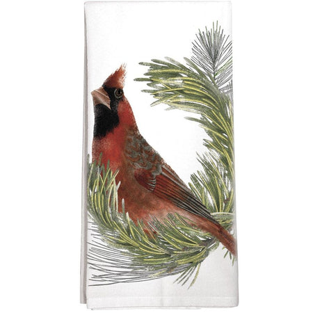 White dishtowel with red cardinal sitting on a pine branch.