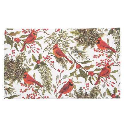 Rectangular fabric placemat with a pattern of red cardinals on holly branches, with pine needles and pine cones as well.