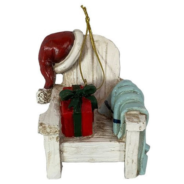 Christmas ornament shaped like an adirondak chair with red Santa hat and Red present on chair.