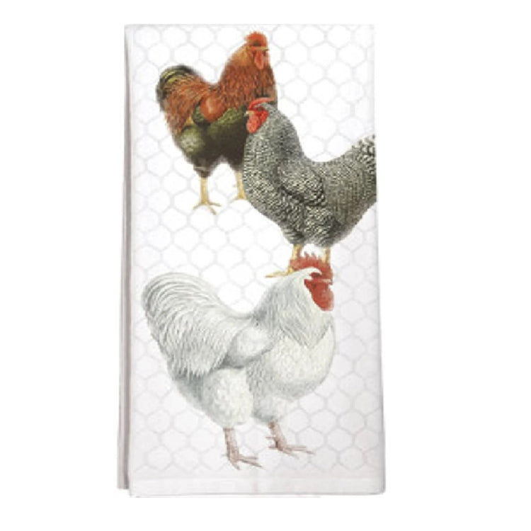 White flour sack towel with three chickens in front of a chicken wire pattern.