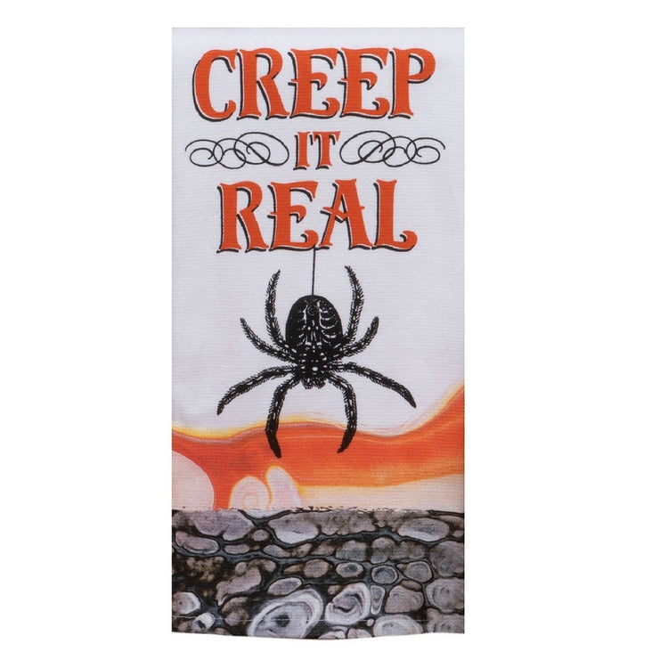 White towel with black and white oil slick pattern on the bottom, and the phrase "Creep it real" with a spider.