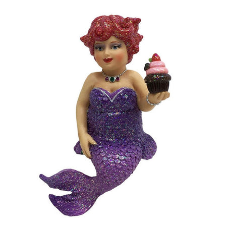 Mermaid figurine ornament.  Dressed in purple holding a cupcake.