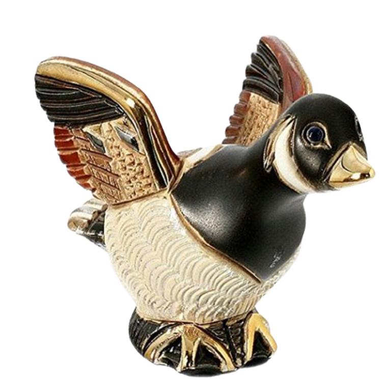 Baby goose figurine with gold embellishments. 