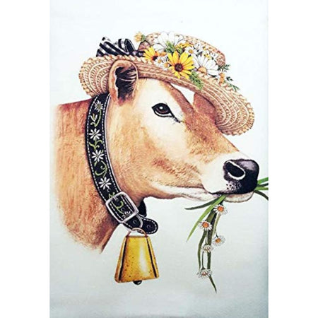White flour sack kitchen towel with cow imprint wearing a flower covered hat and wearing a bell.