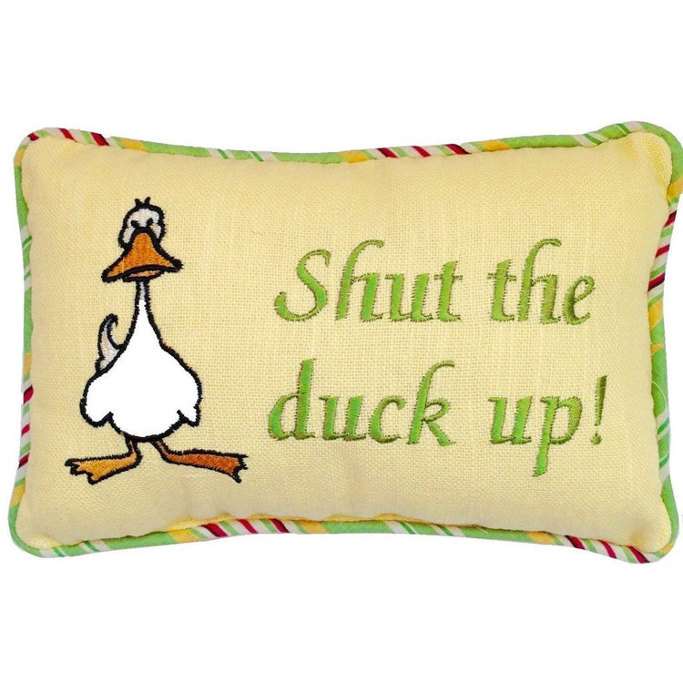 Yellow rectangular pillow with striped border. Standing duck on left, text on right "Shut the duck up!