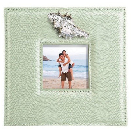 lime green faux leather square frame with silver shell above photo compartment. Photo 2 people on beach. 