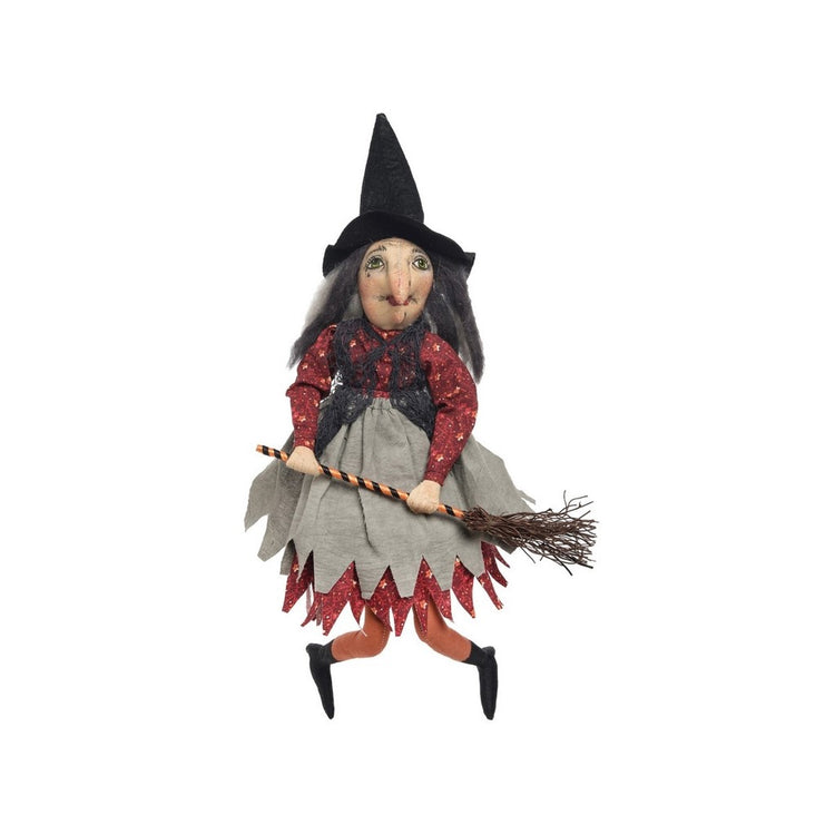 Witch with a red dress & grey apron & hat.