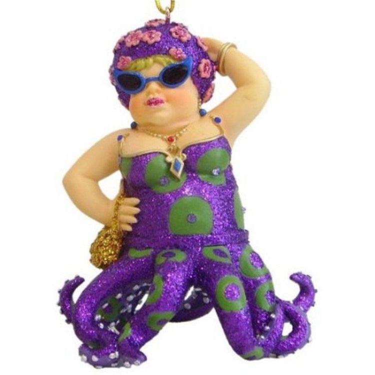 Chunky octopus girl figurine ornament. Wearing purple with green spots, gold purse and headband.