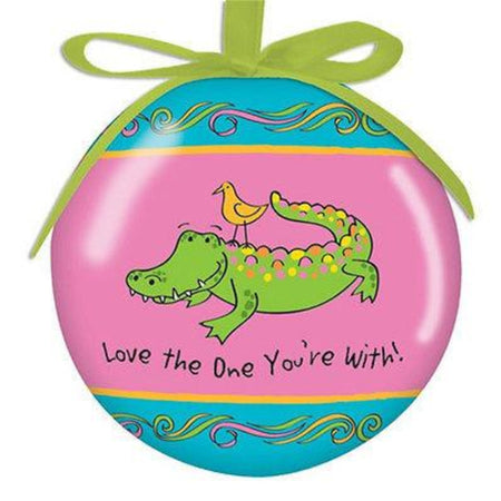 Round Hanging Christmas Ornament with green ribbon cord.  Teal and Pink with alligator and yellow bird.