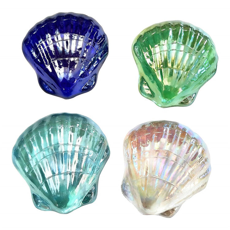 4 iridescent glass clam shell shaped paperweights. 1 is dark blue, 1 is green, 1 light blue, 1 is white clear.