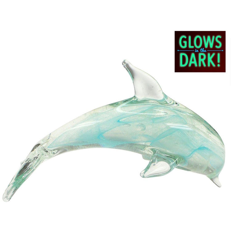 Teal swirled glass dolphin ornament in jumping position. Text above states "Glows in the Dark!"