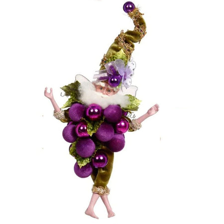 Fairy dressed in a costume like a bunch of grapes.  He is barefoot and wears a green pointy hat with purple accents.