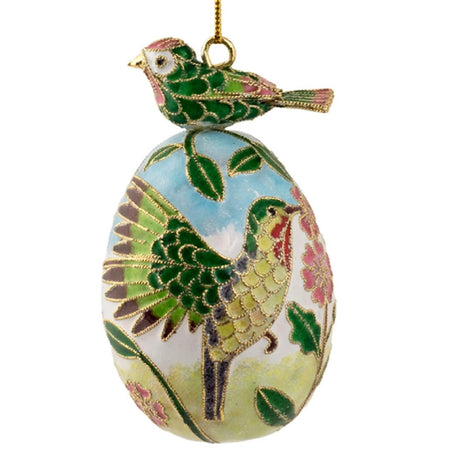 Cloisonné egg ornament with green bird on top. The egg has a green hummingbird and flower design. 