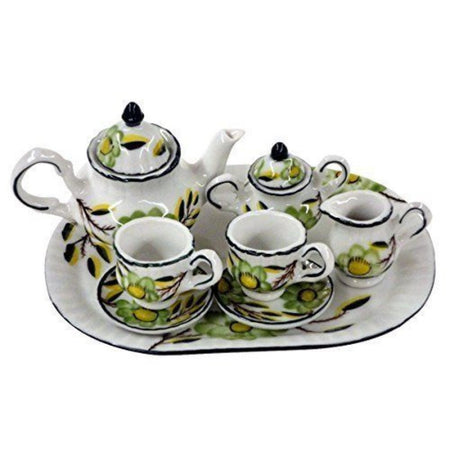 Tea set for 2.  Green floral print on teapot, creamer, sugar, 2 cups and saucers and tray.