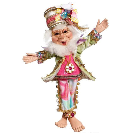 Elf figure, barefoot. Wears tye-dye pants with tassel edges and a hat that looks like a top hat with no rim.  Tye-Dye is pink and blue. He wears a green jacket.