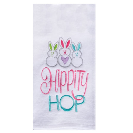 White towel with 3 small embroidered bunnies with different color ears, the words "hippity hop" are also embroidered in pink and like blue.