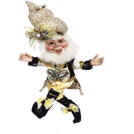 Elf figure dressed as a honey bee. Honey beehive design hat in gold. He wears a black and yellow outfit in pants and log sleeves with matching booties.  He has a bee embellishment on his shirt.