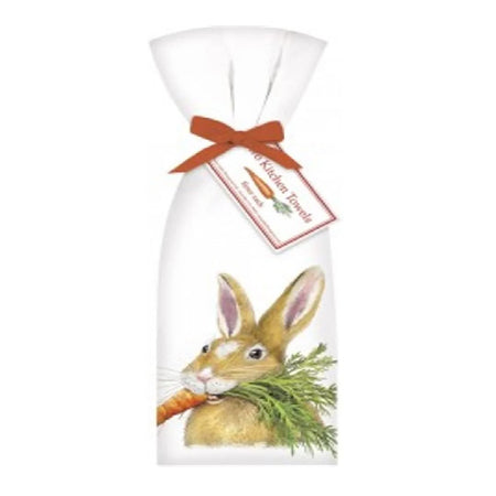 white flower sack towel with an orange ribbon. The towel has a brown rabbit with a carrot in its mouth, screen printed on it.