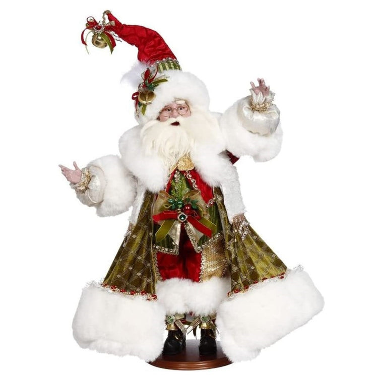 Santa figurine in a long green velvet coat with white fur trim. He's also wearing coordinating red and gold pants and hat.