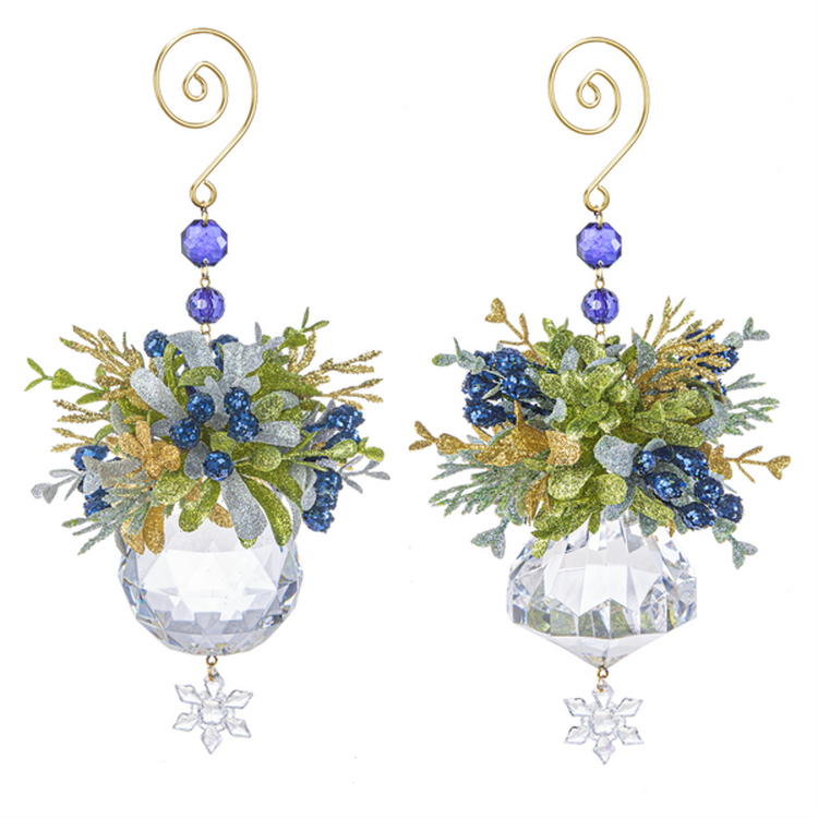 2 ornaments made of blue glittered mistletoe on top of a clear acrylic ball with snowflake shaped dangle. The hooks are gold with blue beads.