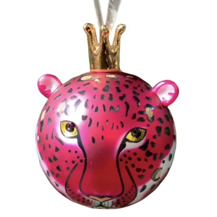 Blown glass ball ornament, hand painted to look like a pink leopard. Ears stick out near the top & ribbon is attached to the ornaments with a tall gold crown.