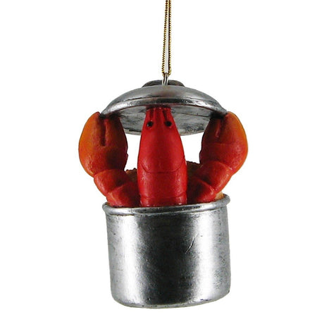 Silver roast pot with red lobster holding the lid coming out of the top.