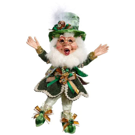 Elf figurine dressed in a green leprechaun outfit with a green top hat and shoes.  Elf is wearing glasses.